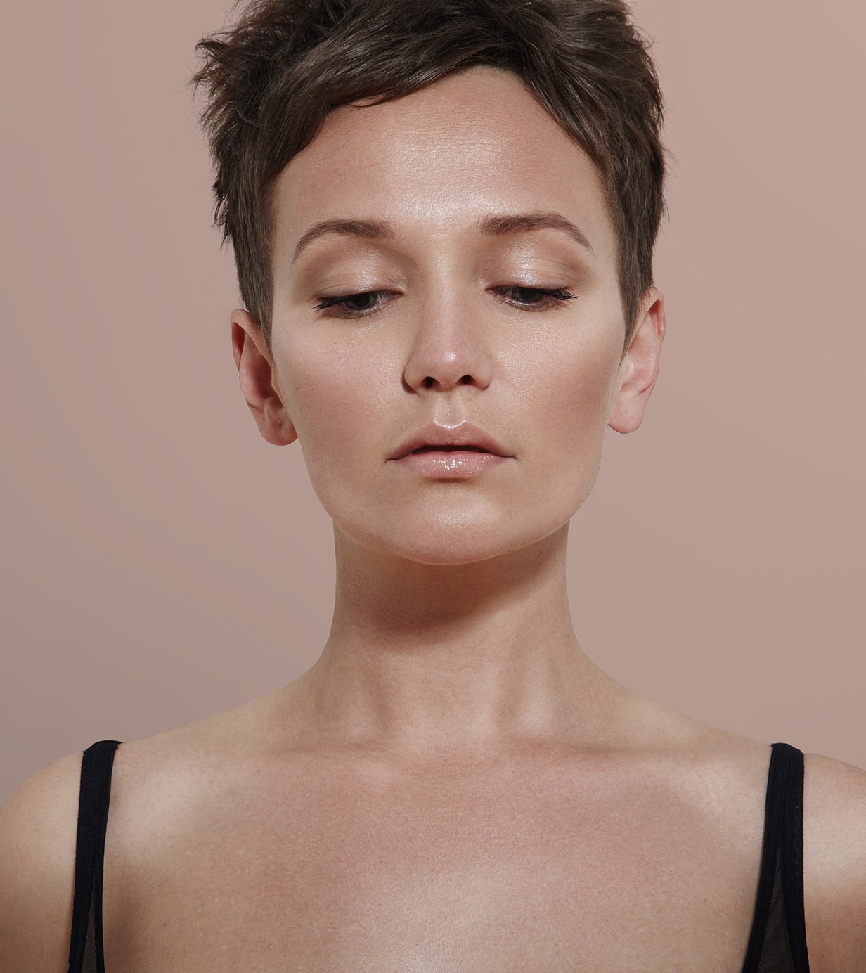 Beauty woman with ideal skin looking down 1