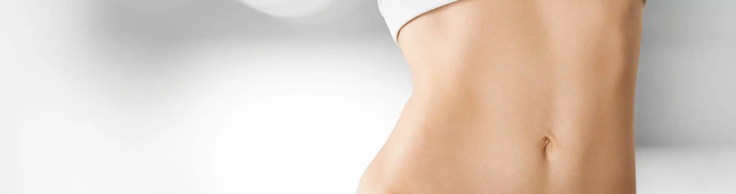 Close-up of a woman's body against a blurred background