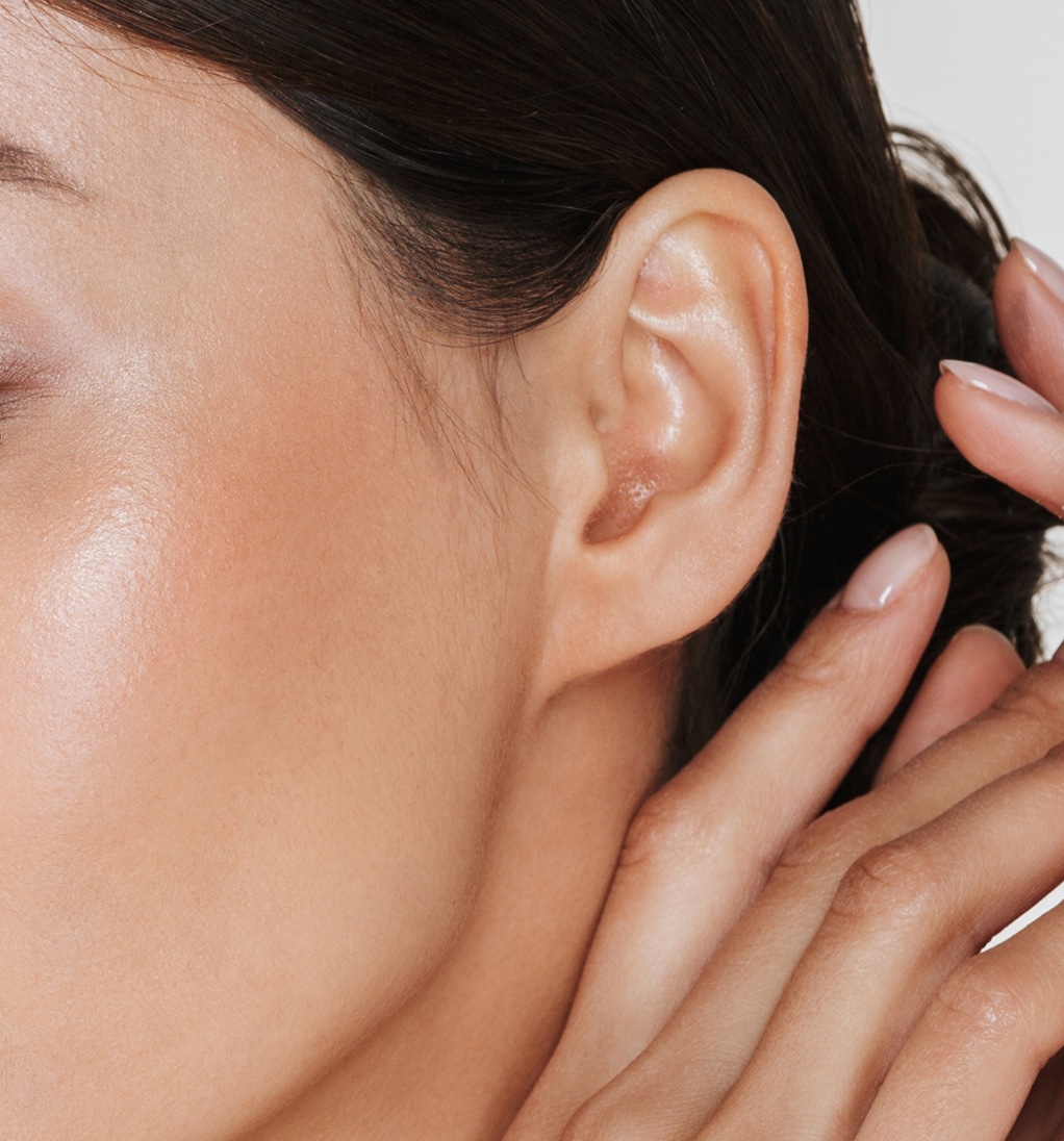Close up relaxed brunette woman with clean skin posing camera with closed eyes isolated white 1 1