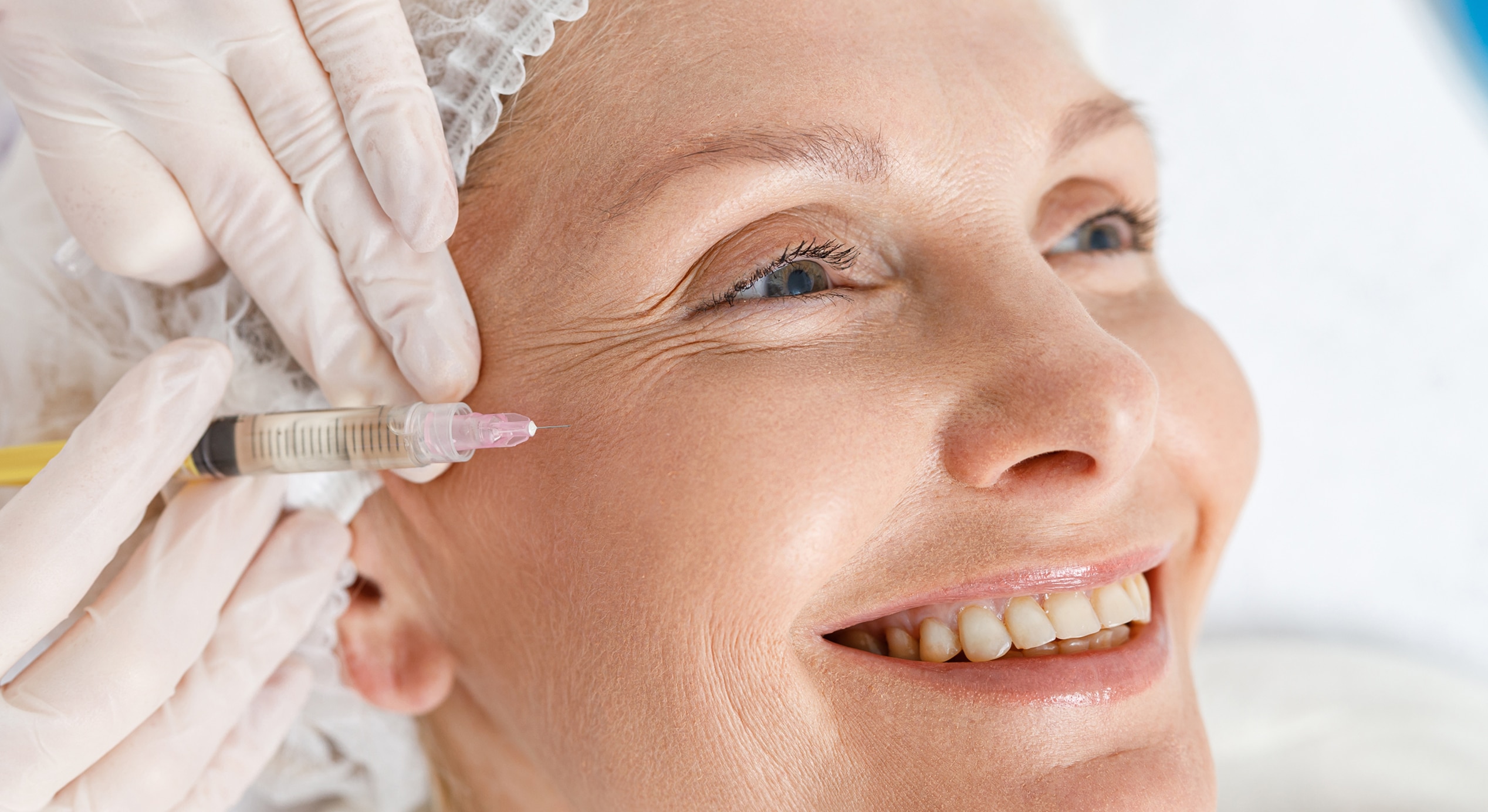 Close up treatment senior woman by beautician tightening smoothing wrinkles face skin 1