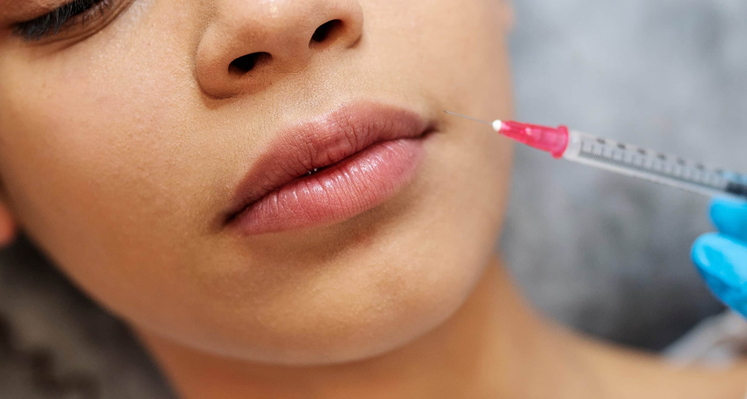 Close up woman getting hyaluronic acid injection 1