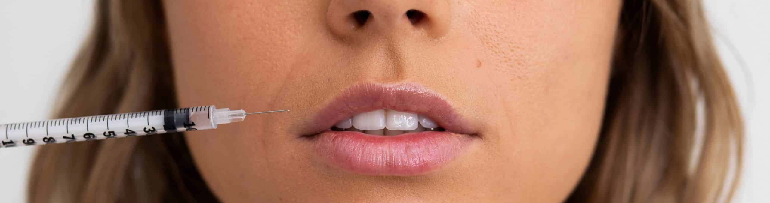 Close up woman getting lip filler 1