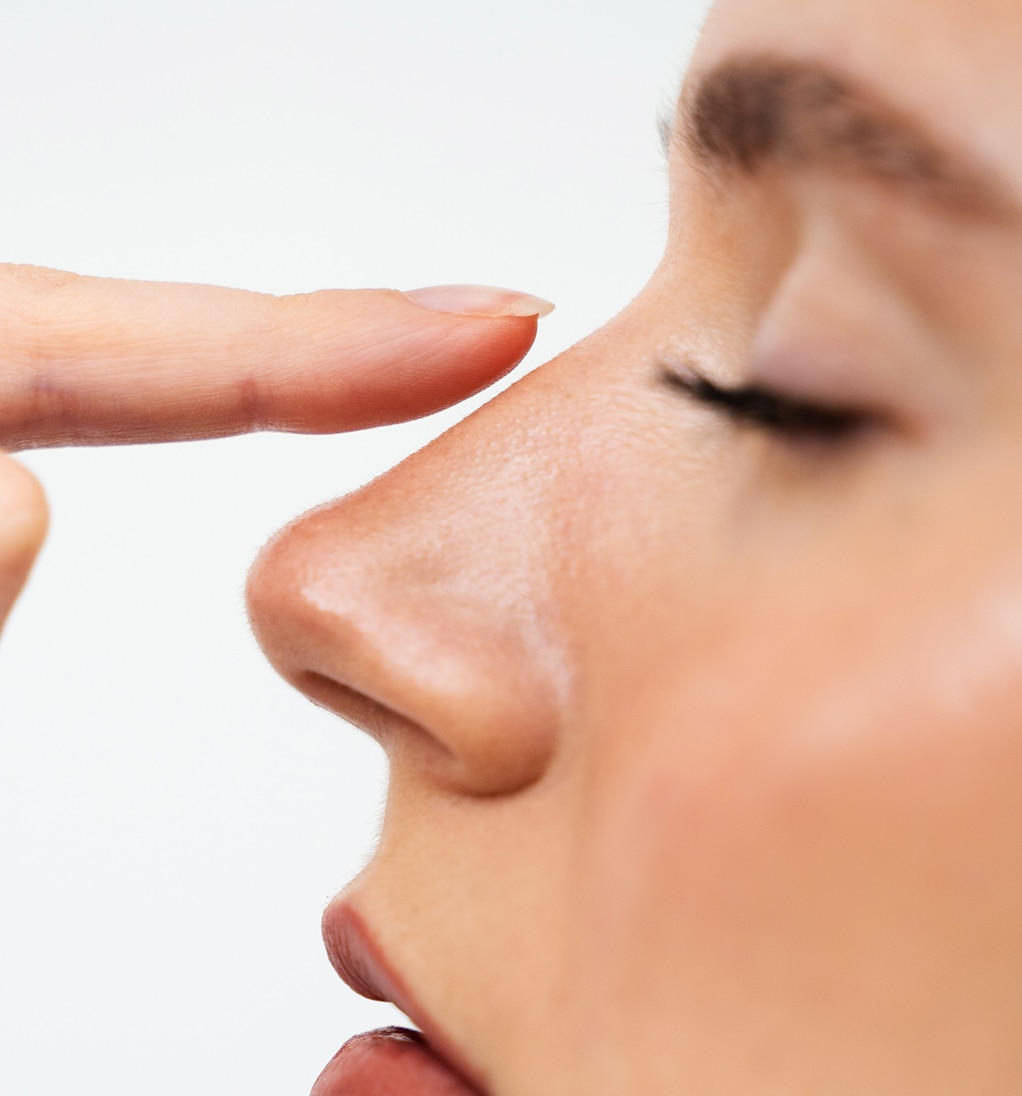 Closeup rhinoplasty reshape nose improve breathing attractive girl touches her nose before septoplasty 1 1