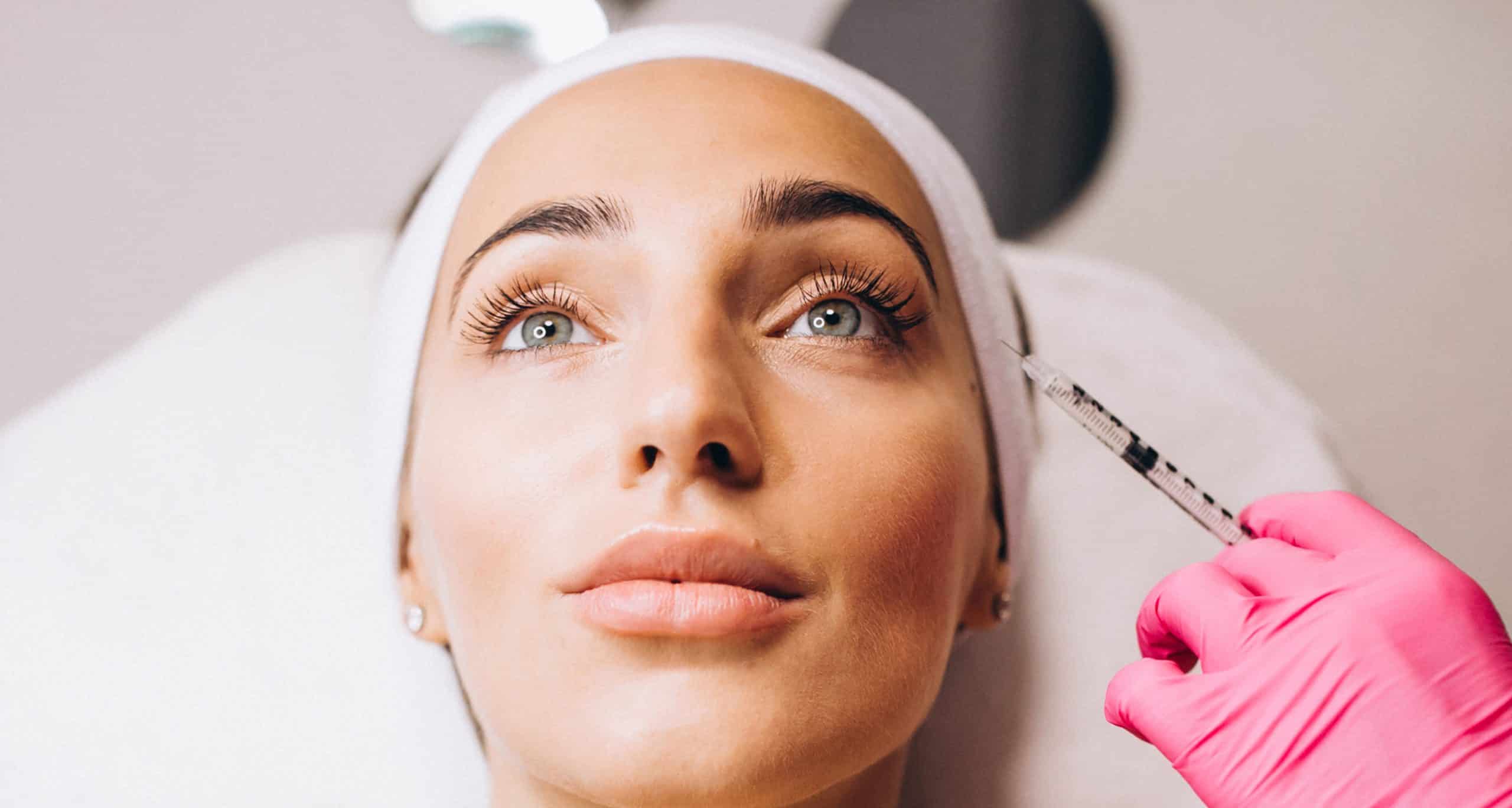 Cosmetologist making injections face woman beauty salon 1
