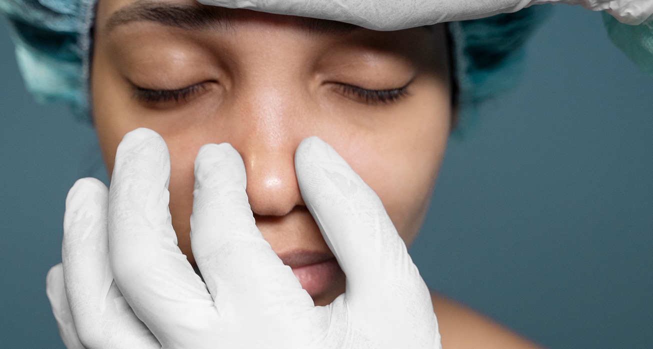 Doctor checking patient s nose before surgery 1