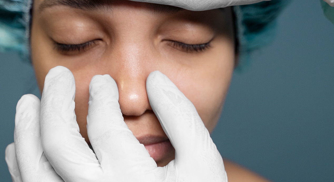Doctor checking patient s nose before surgery 2