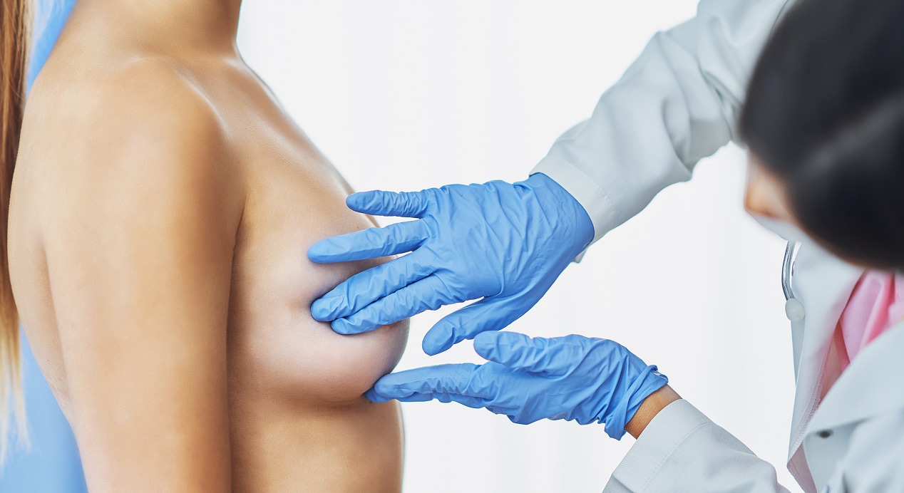 Doctor mask checking up breast her patient 1