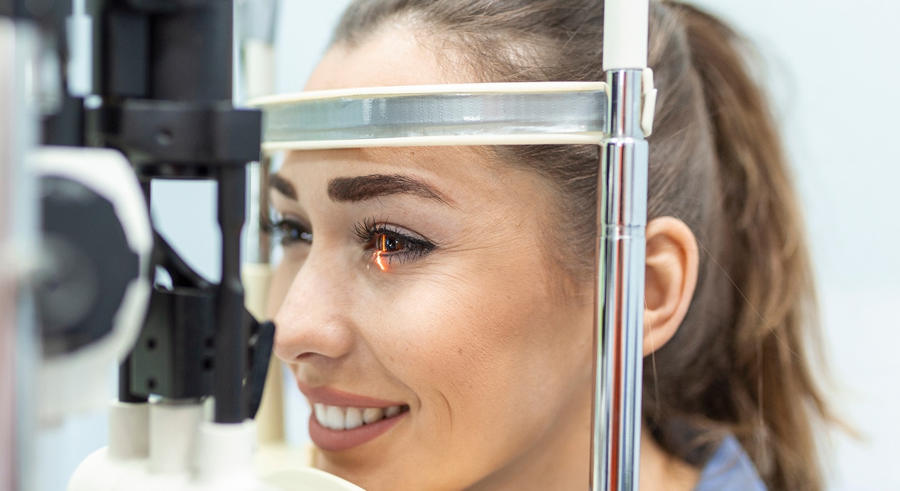 Eye doctor with female patient examination modern clinic ophthalmologist is using special medical equipment eye health…