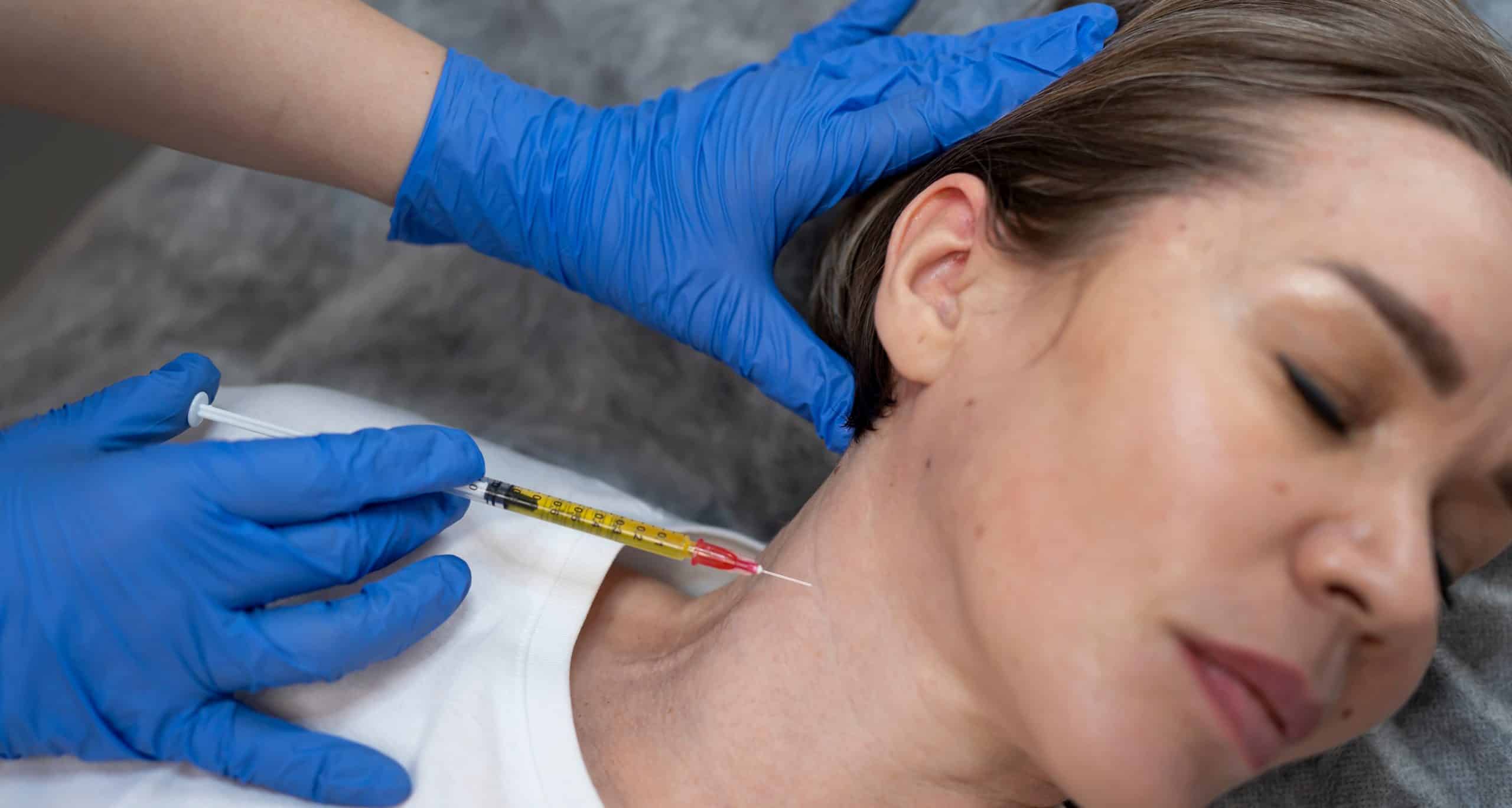 Flat lay woman getting prp injection 1