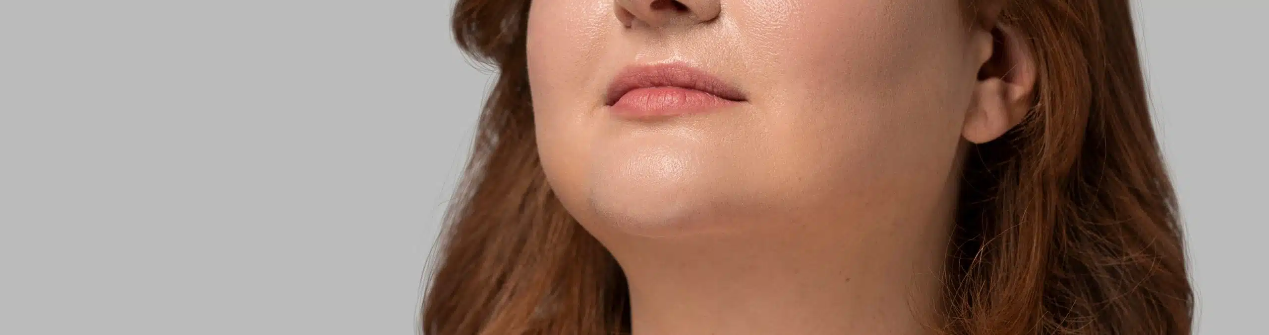 Plus-size woman posing in a studio