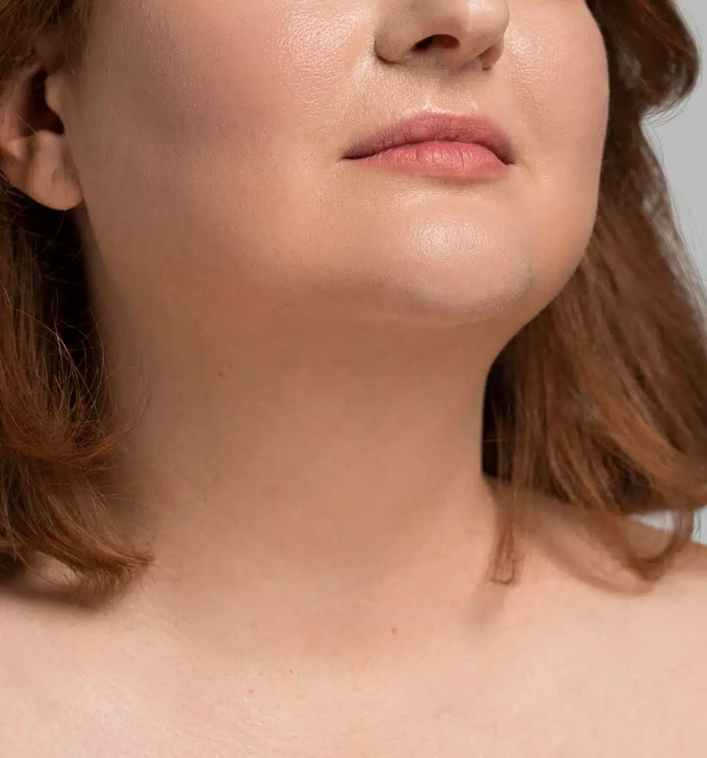 Plus-size woman posing in a studio
