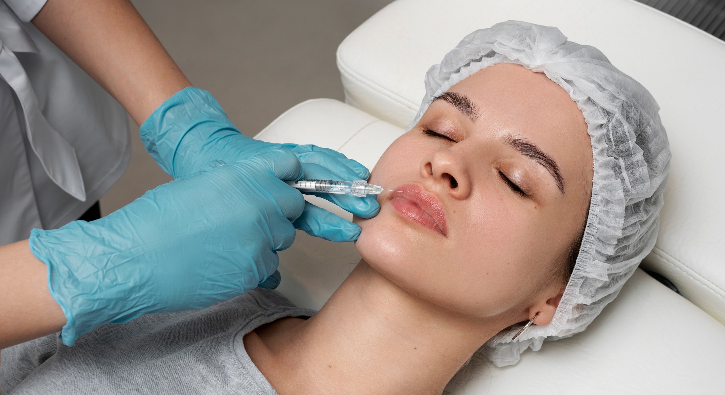 High angle woman getting lips injection 1