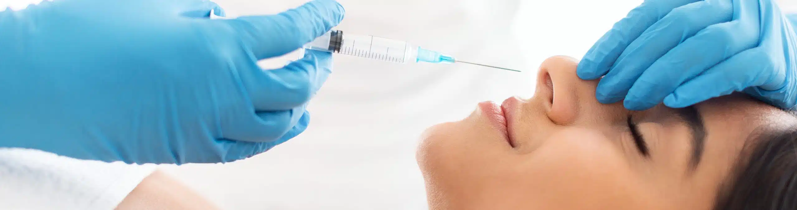 Woman receiving a non-surgical rhinoplasty treatment