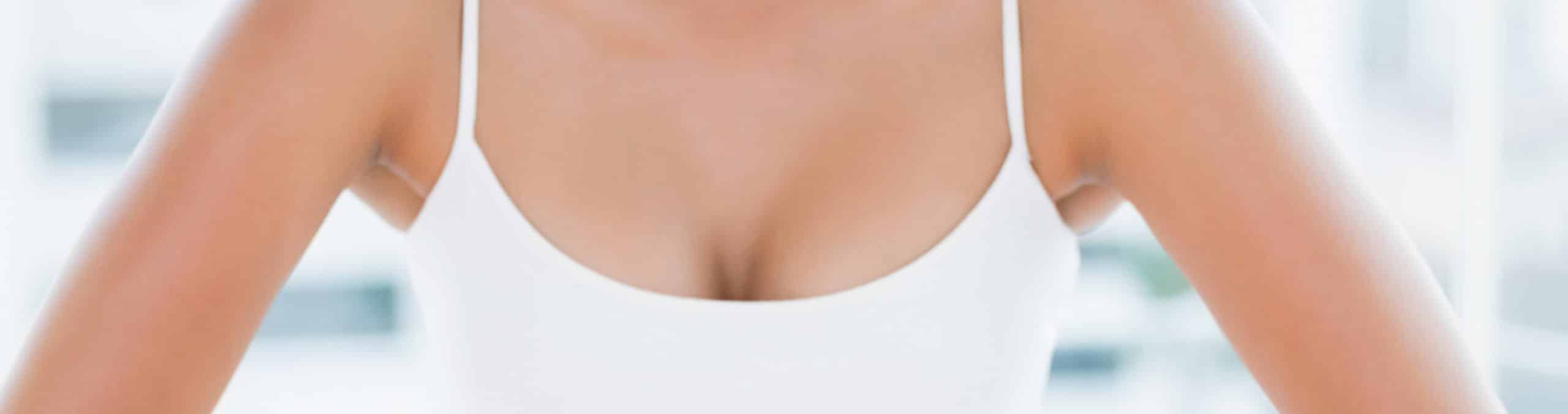 Laughing toned brunette standing hands hips 1
