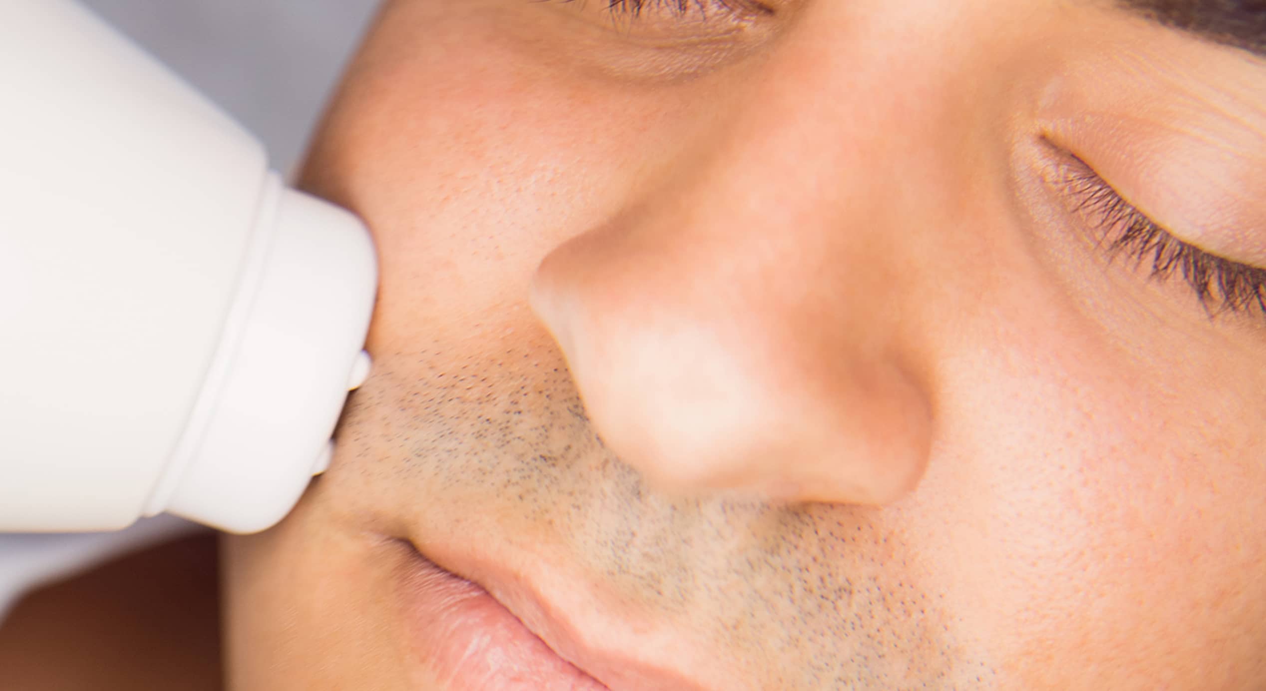 Man getting facial massage clinic 1 1