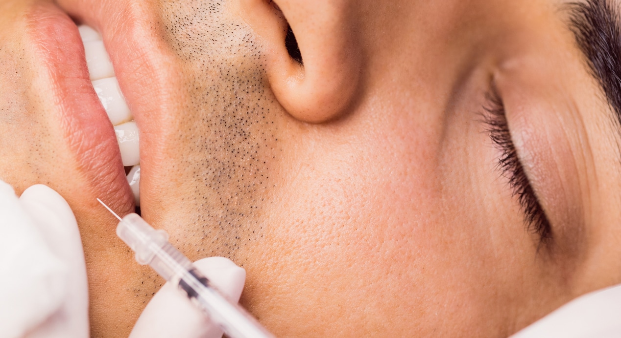 Man receiving botox injection his lips 1
