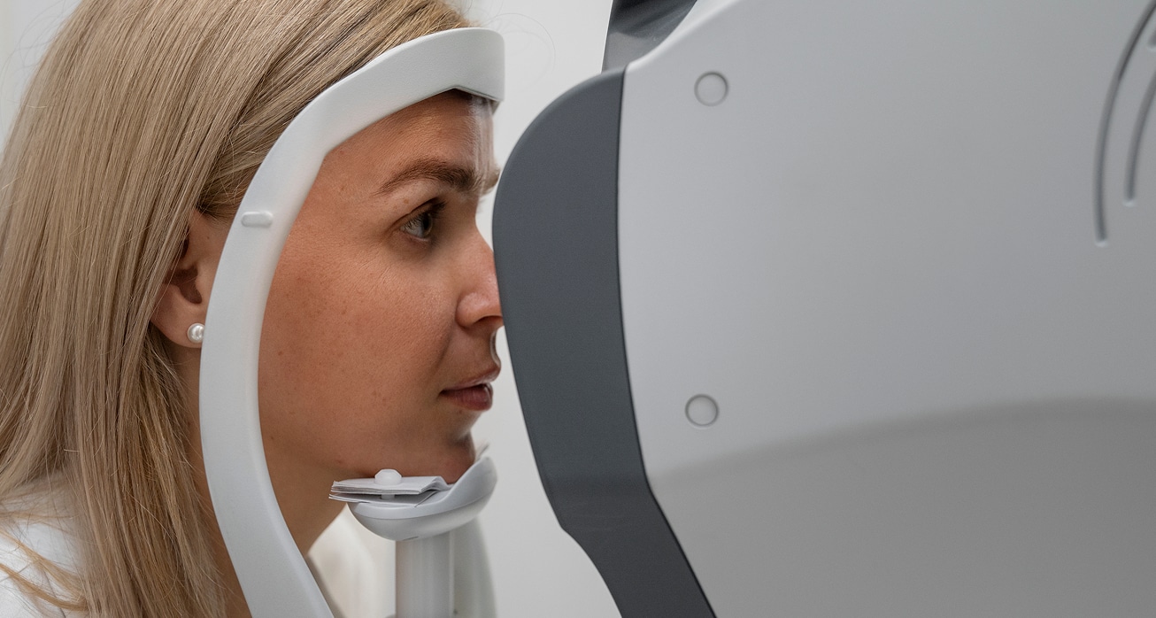 Medium shot woman getting her eyes checked 1