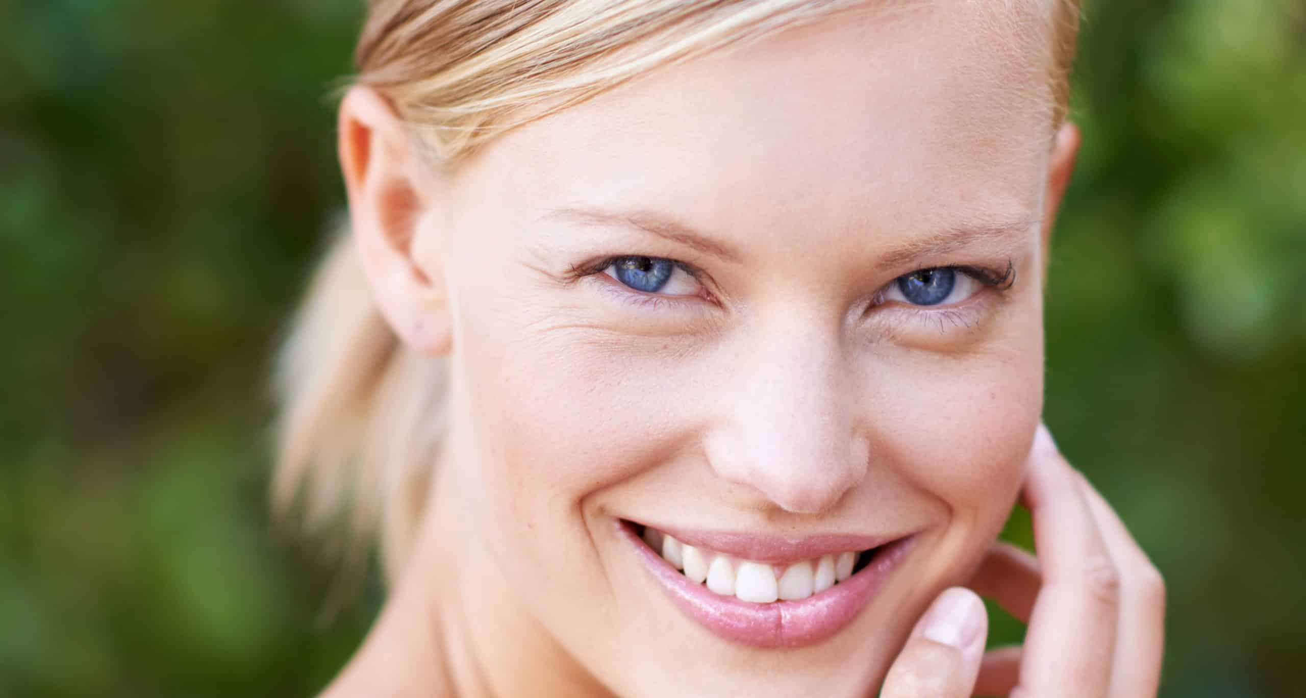 My skin feels amazing portrait attractive young woman touching her face 1