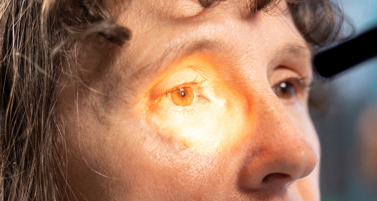 Optometrist examining eyesight with diagnostic tools female patient 1