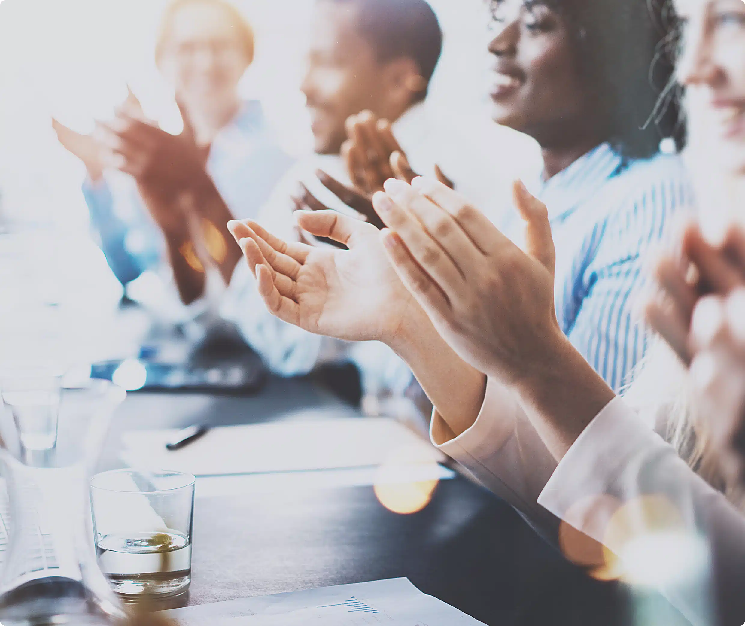 Audience applauding at a meeting