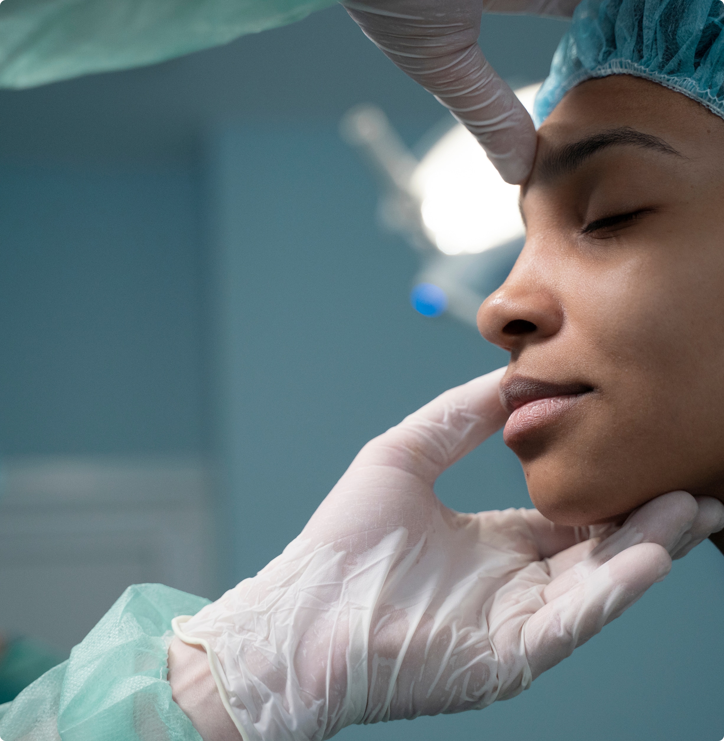 Side view doctor checking patient before rhinoplasty 1