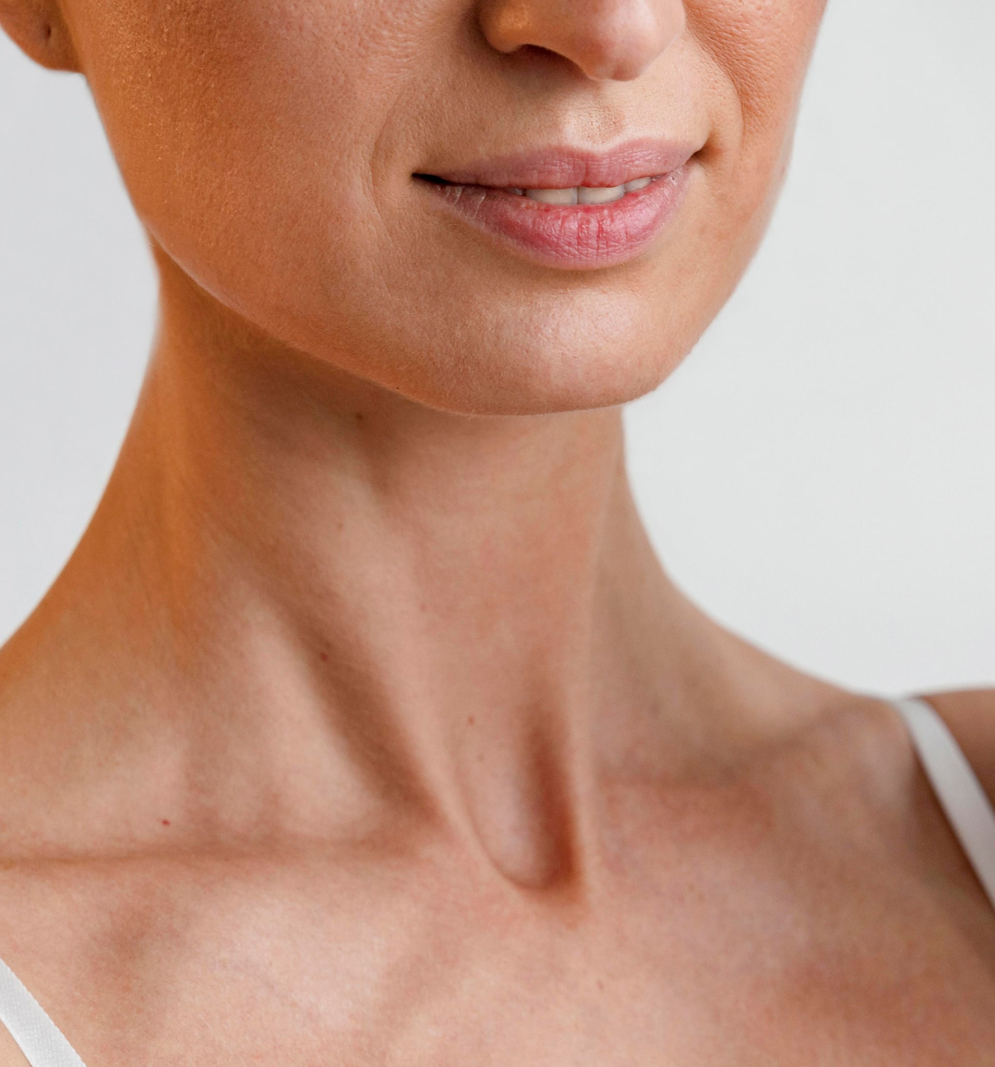 Smiley woman holding yoga mat 1