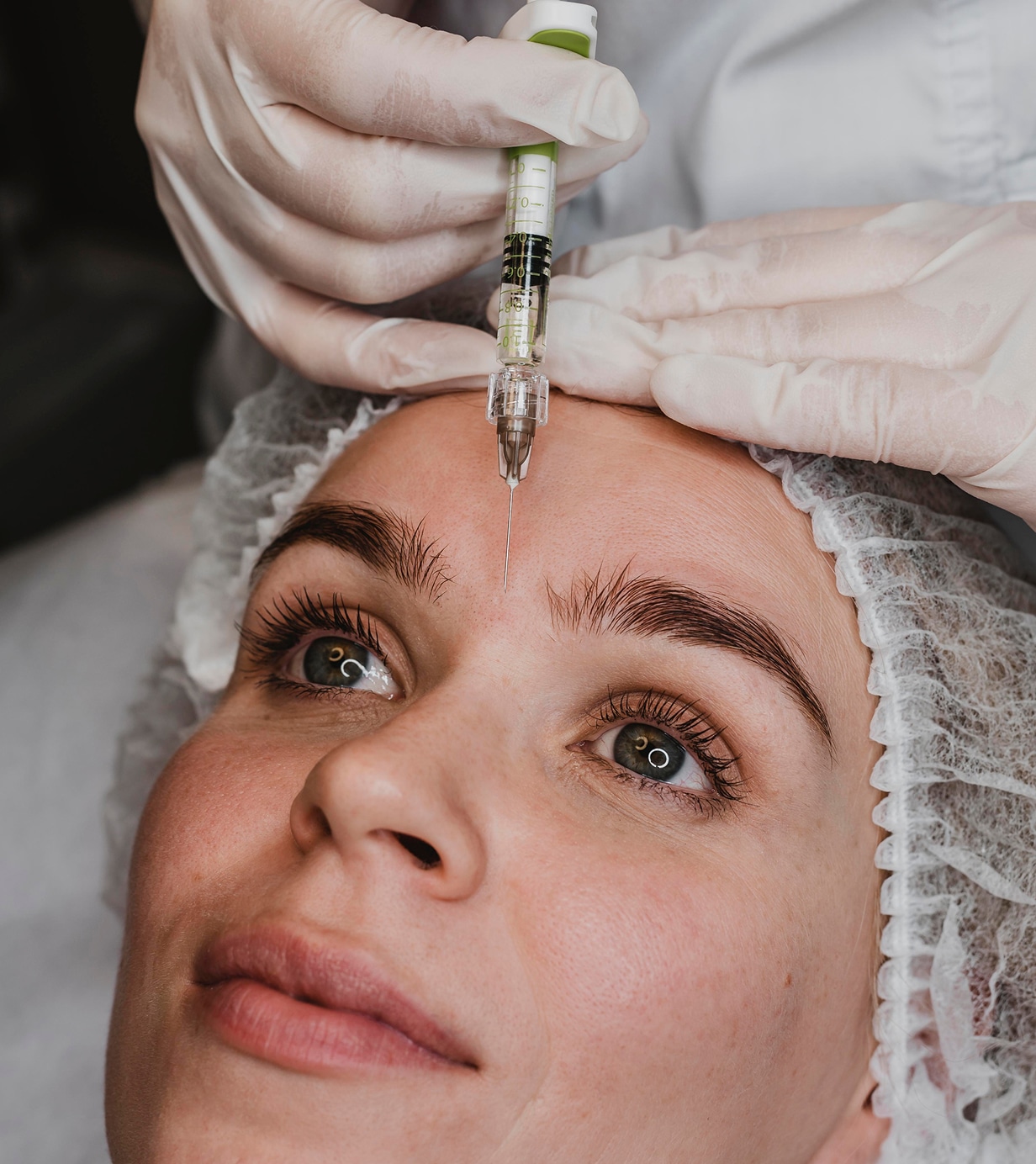 Woman getting facial beauty injection wellness center 1