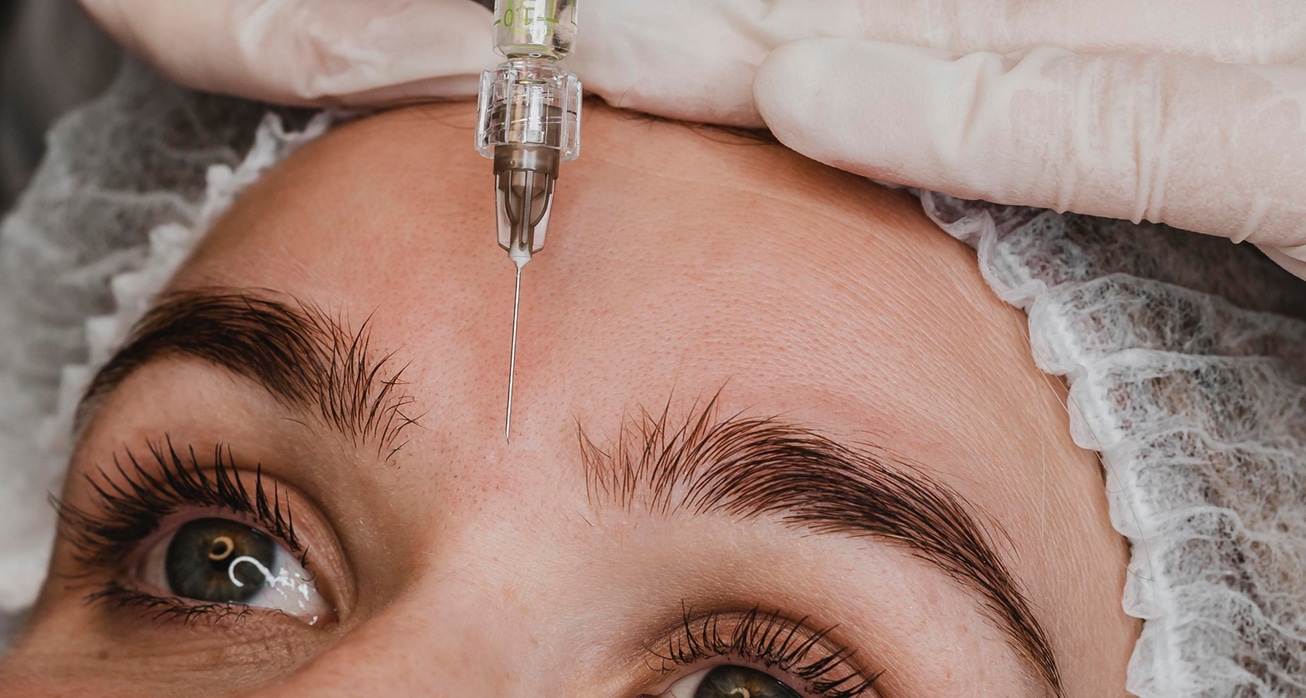 Woman getting facial beauty injection wellness center 2