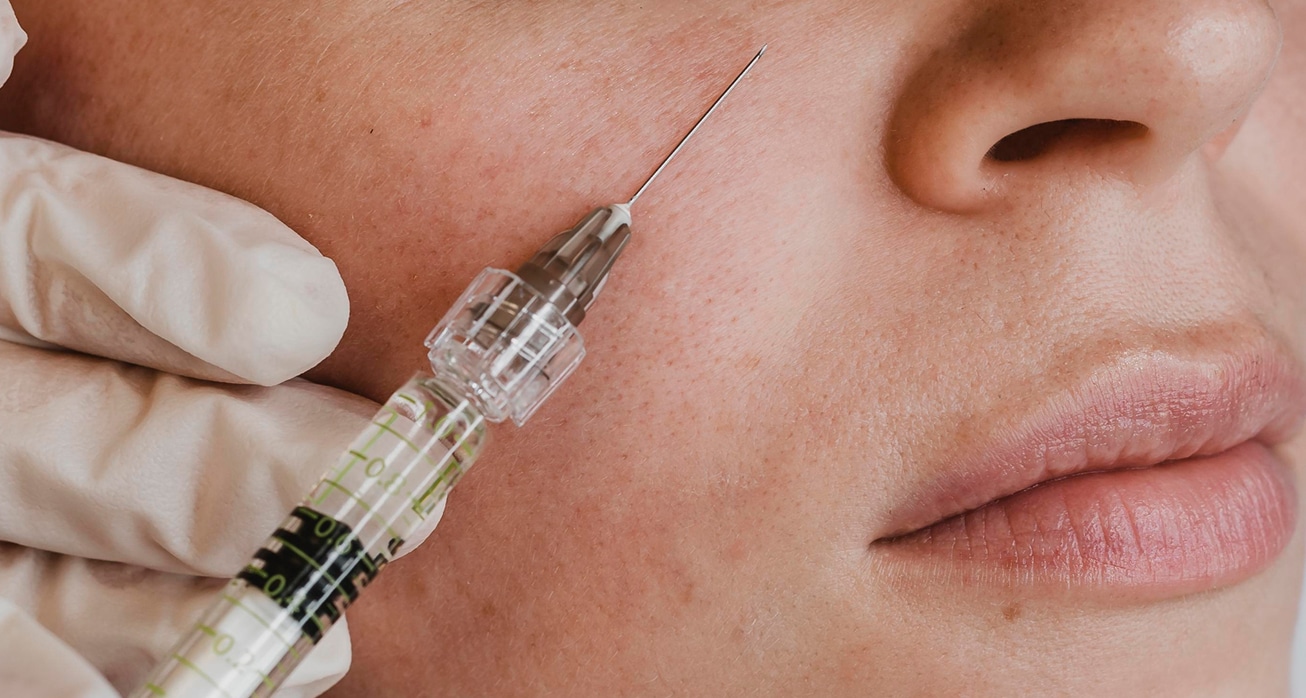 Woman getting facial beauty treatment wellness center 1