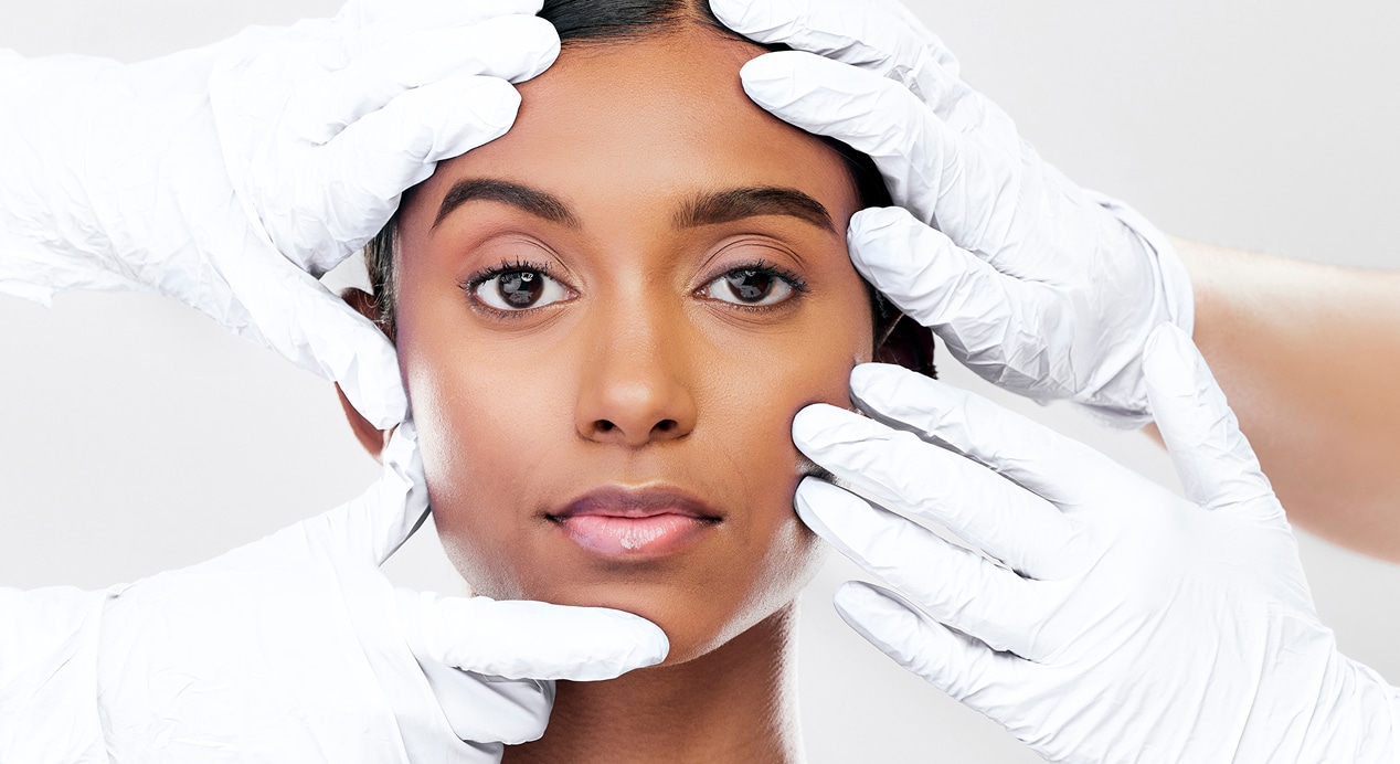 Woman plastic surgery hands studio portrait with beauty skincare face with process by white background change model…