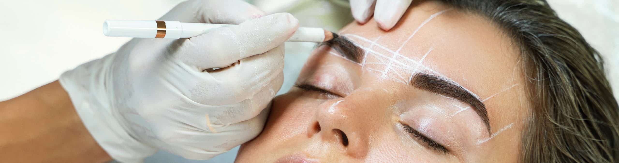 Woman professional eyebrow mapping procedure 1