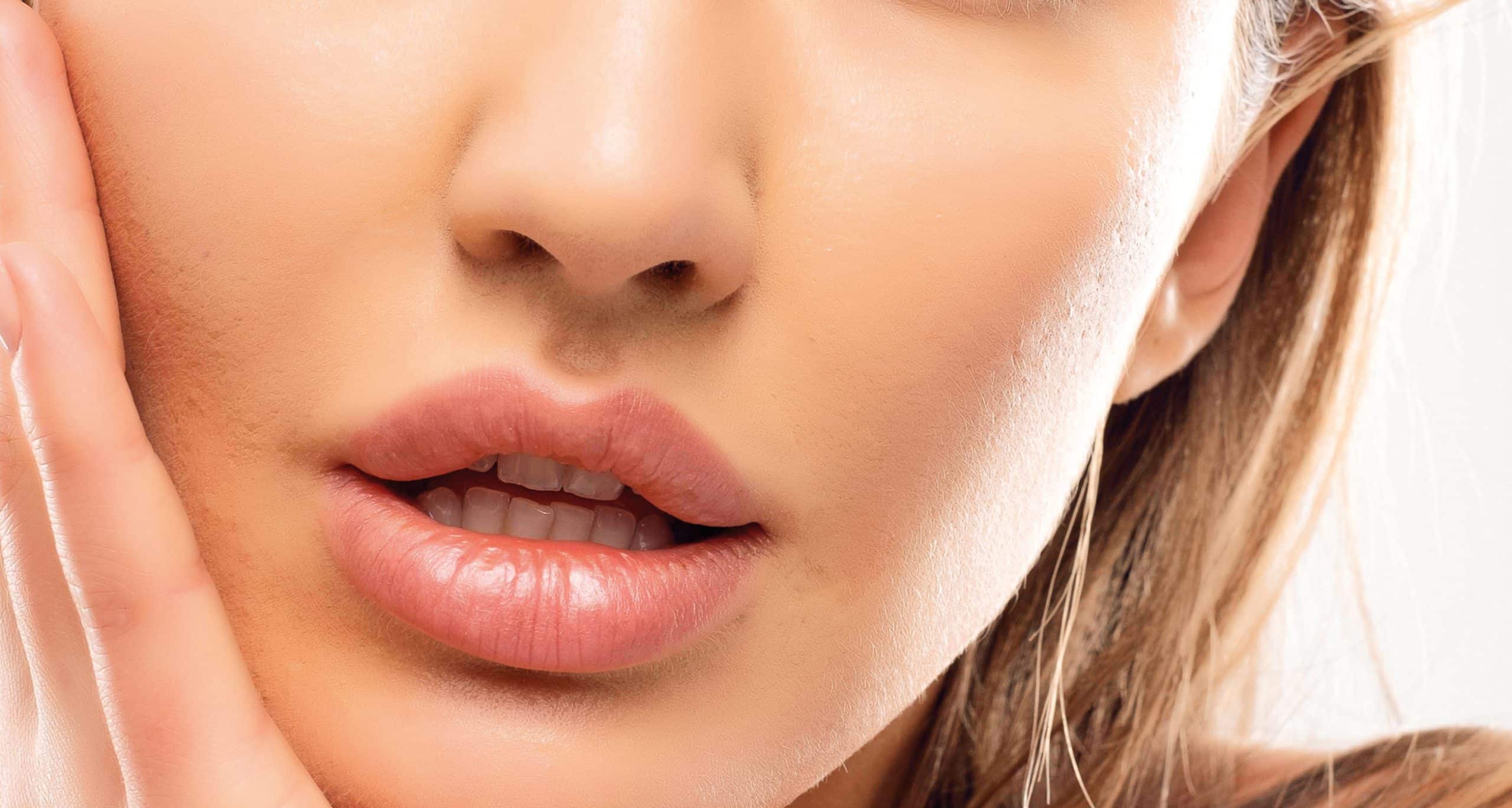 Wonderful lady with beautiful face big lips white teeth blue eyes soft skin hand cheek manicure volume blonde hair…