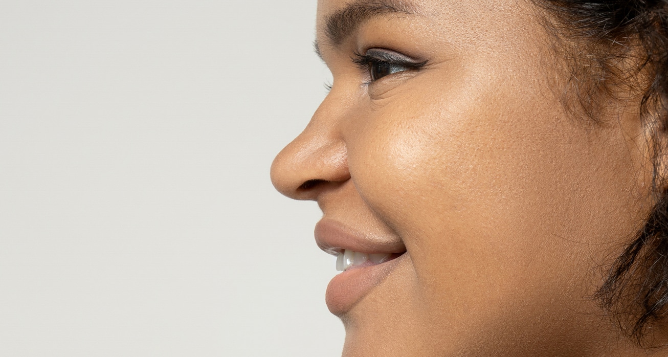 Young african american woman posing against white background 1
